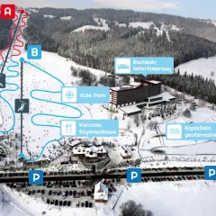 Widok na zakopane stok narciarski z trasami, wyciągami, hotelem Bachleda, karczmą i basenem geotermalnym.